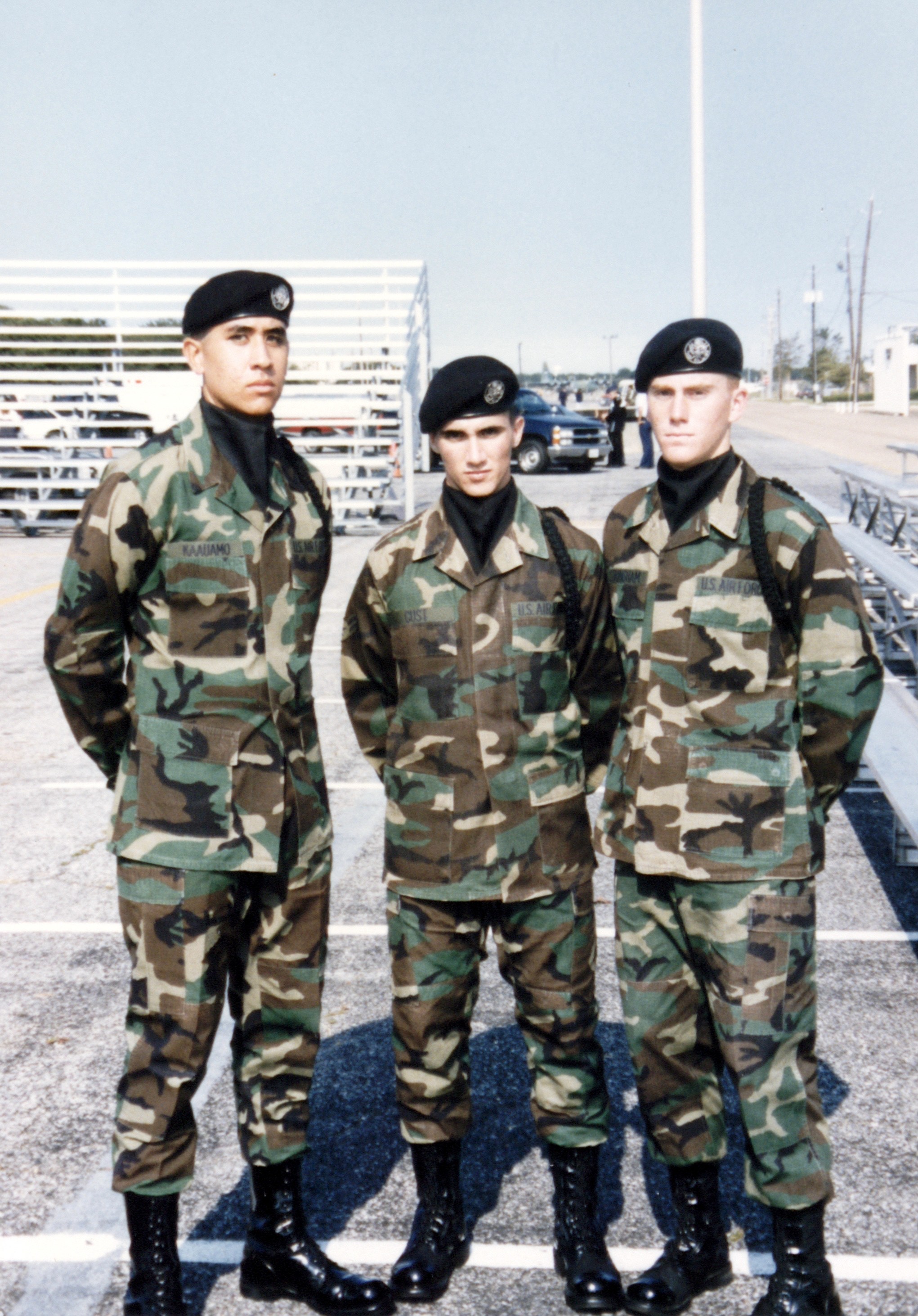 Jason standing between two members of his USAF drill team squad
